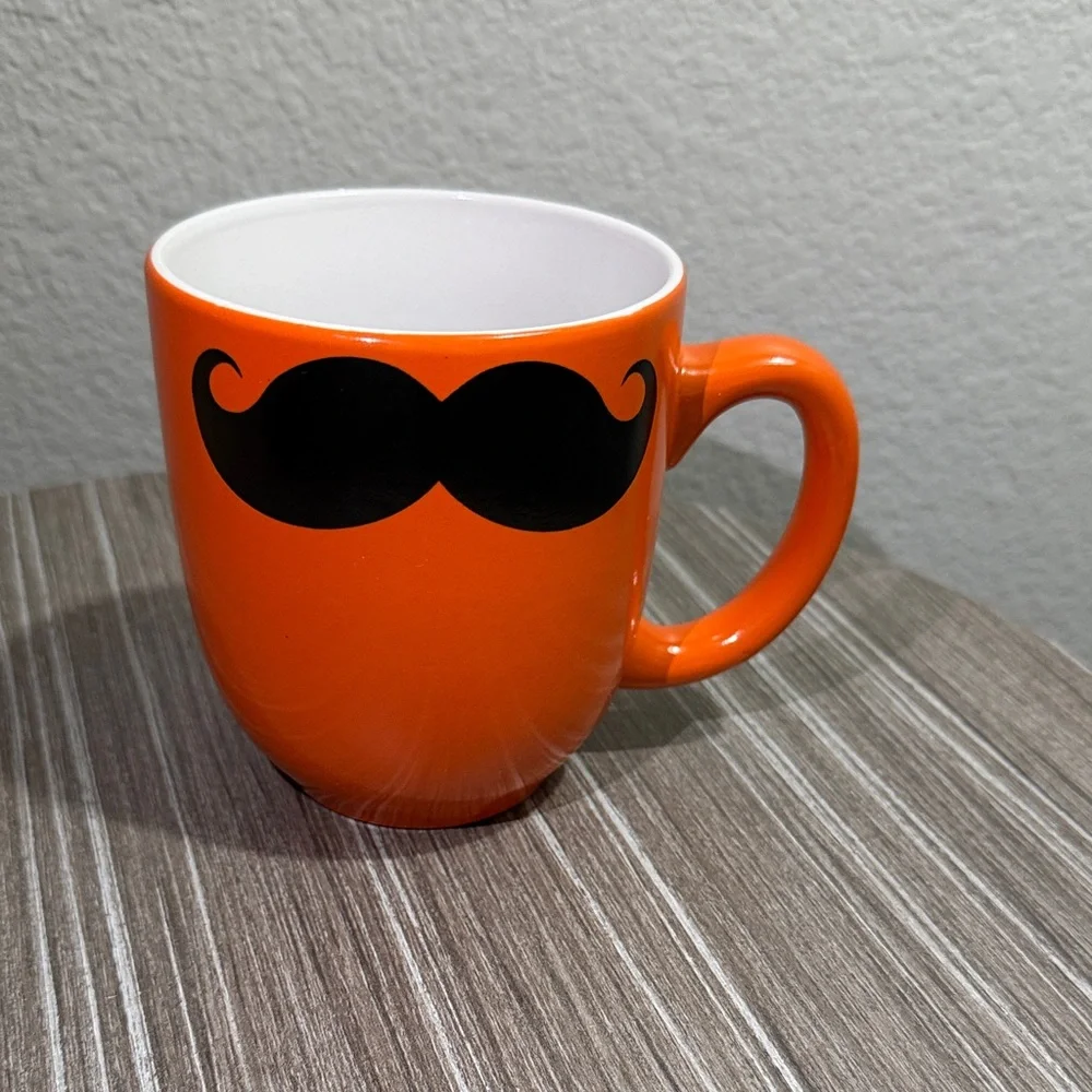 Orange Mug with Black Mustache Design
